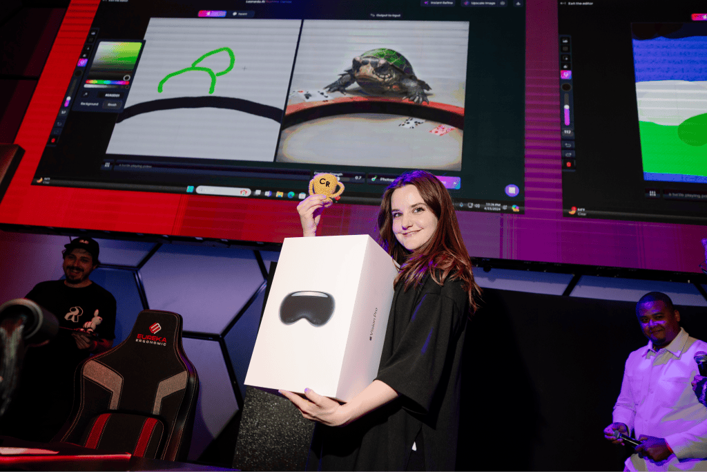 Curious Refuge AI esports winner holding vision pro